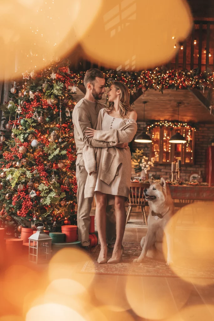 candid-authentic-happy-married-couple-spends-time-together-with-japanese-dog-xmas-lodge