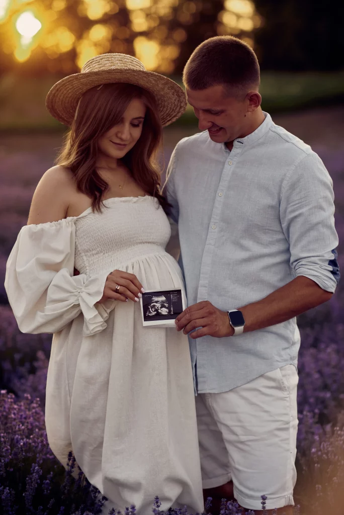 portrait-young-pregnant-couple-holding-first-ultrasonography-image-happy-family-concept