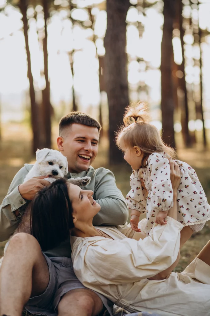 young-family-with-cute-little-daughter-resting-forest-sunset